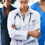 The picture features several people, all wearing scrubs or lab coats, who work in the medical or referral fields.